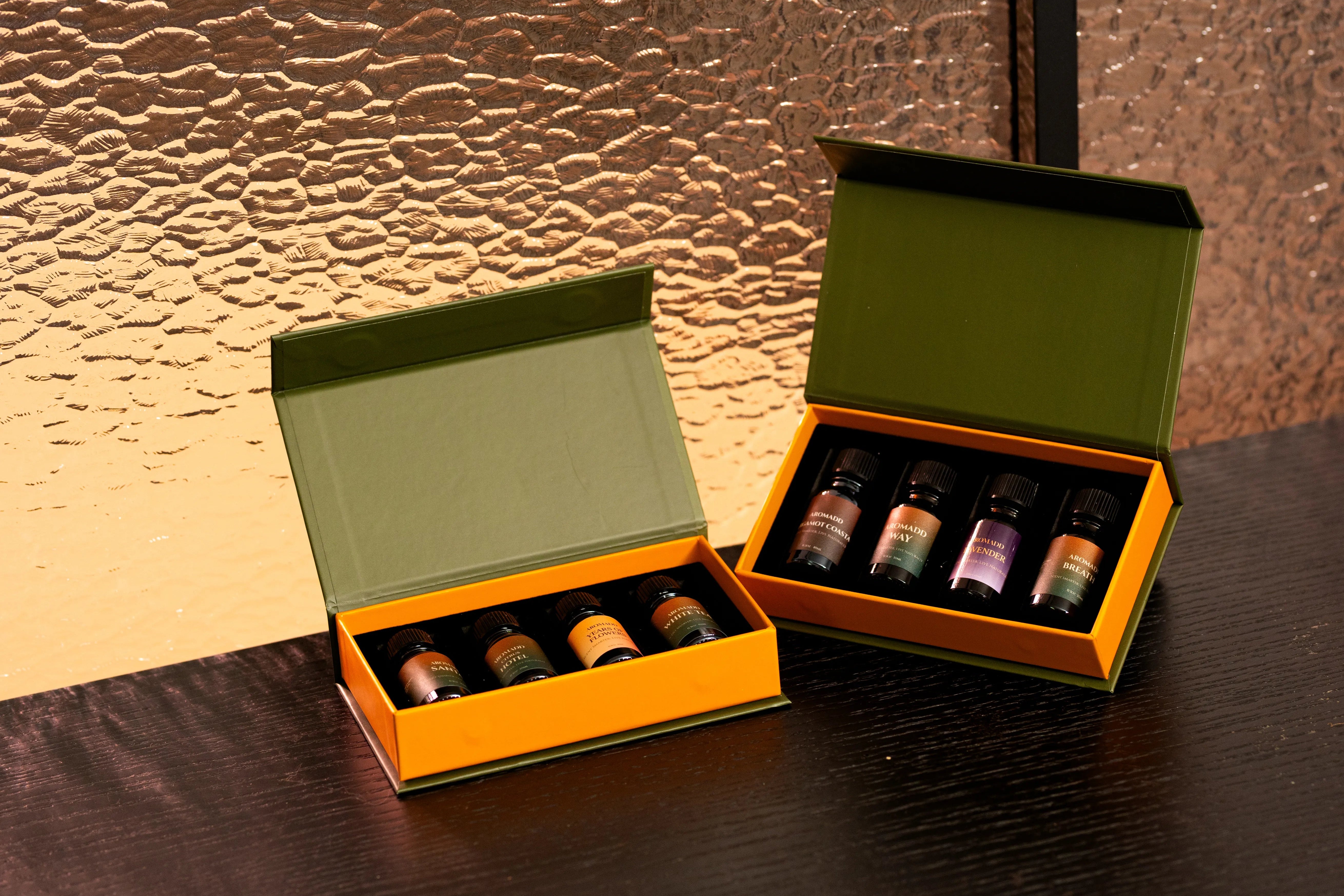 Aromadd scent oil sample set collection in open green gift boxes
